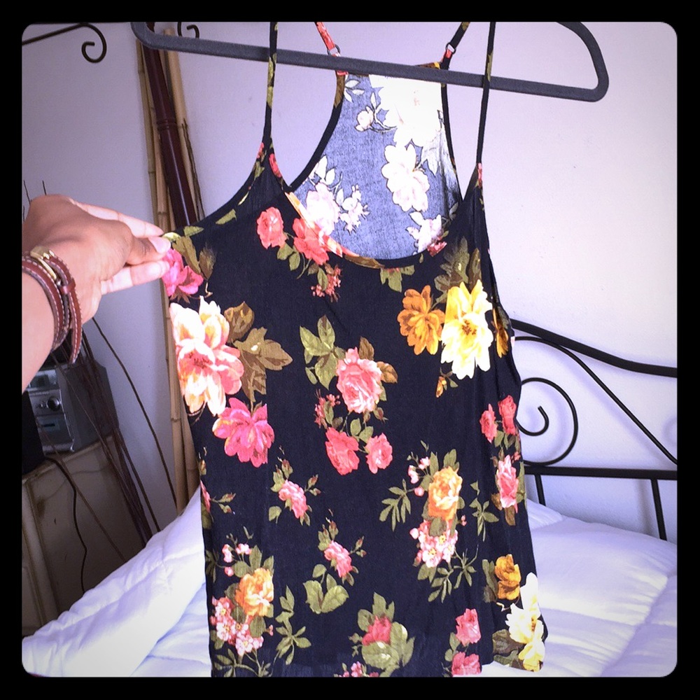 Floral black tank , adjustable straps.never worn
